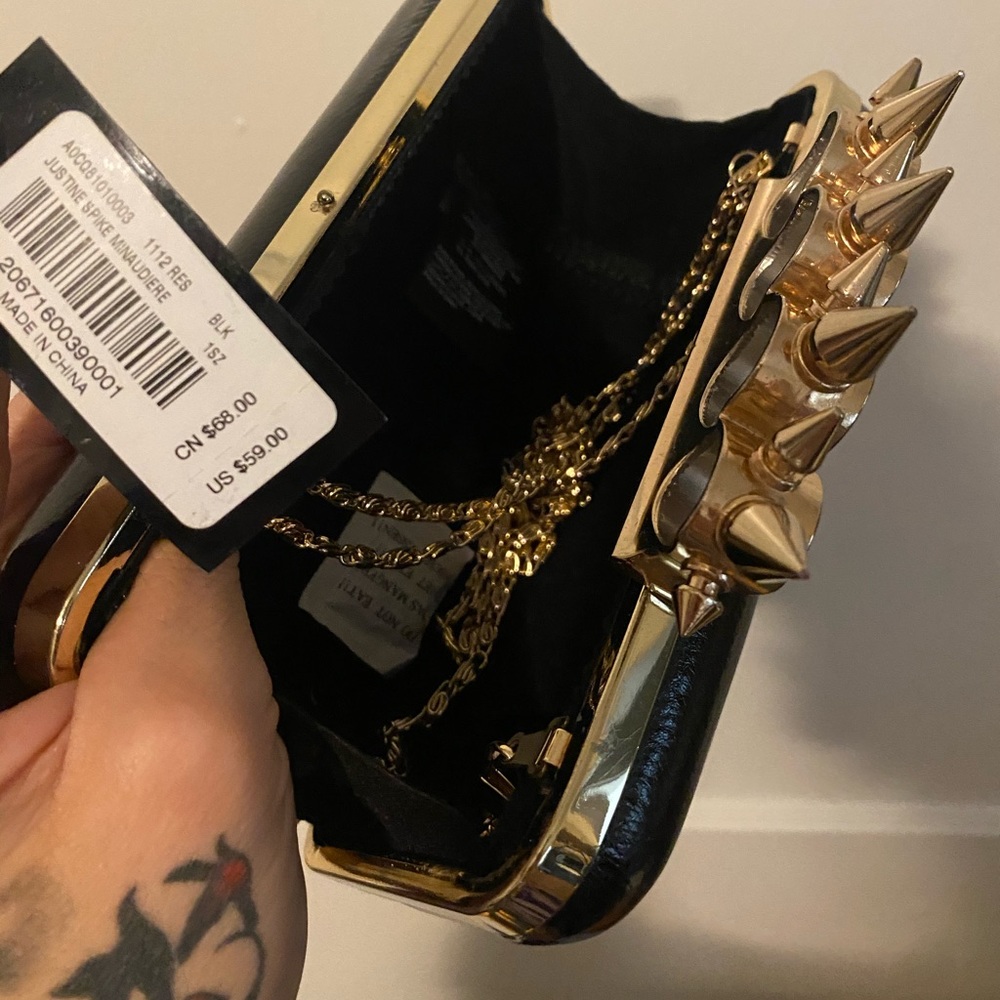 Bebe brass knuckle clutch